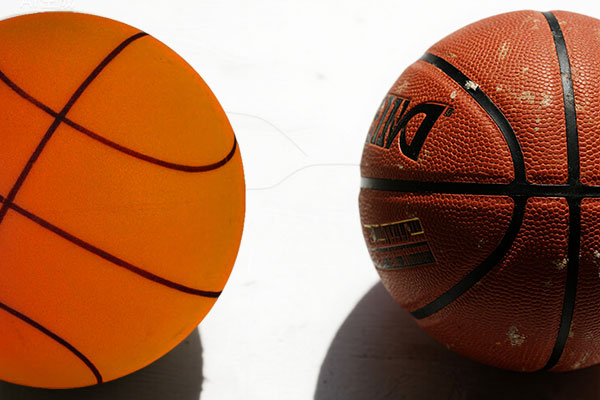 Silent basketball foam vs traditional rubber material, scientific diagram comparing texture and friction properties of quiet basketball materials.